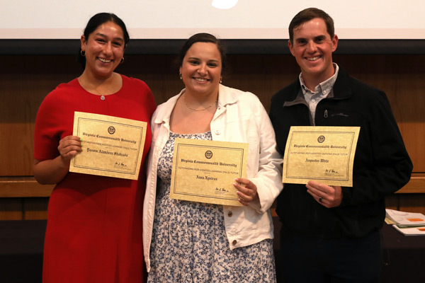 Three students standing with certificates for the 2026 Outstanding Peer Assisted Tutor Learning