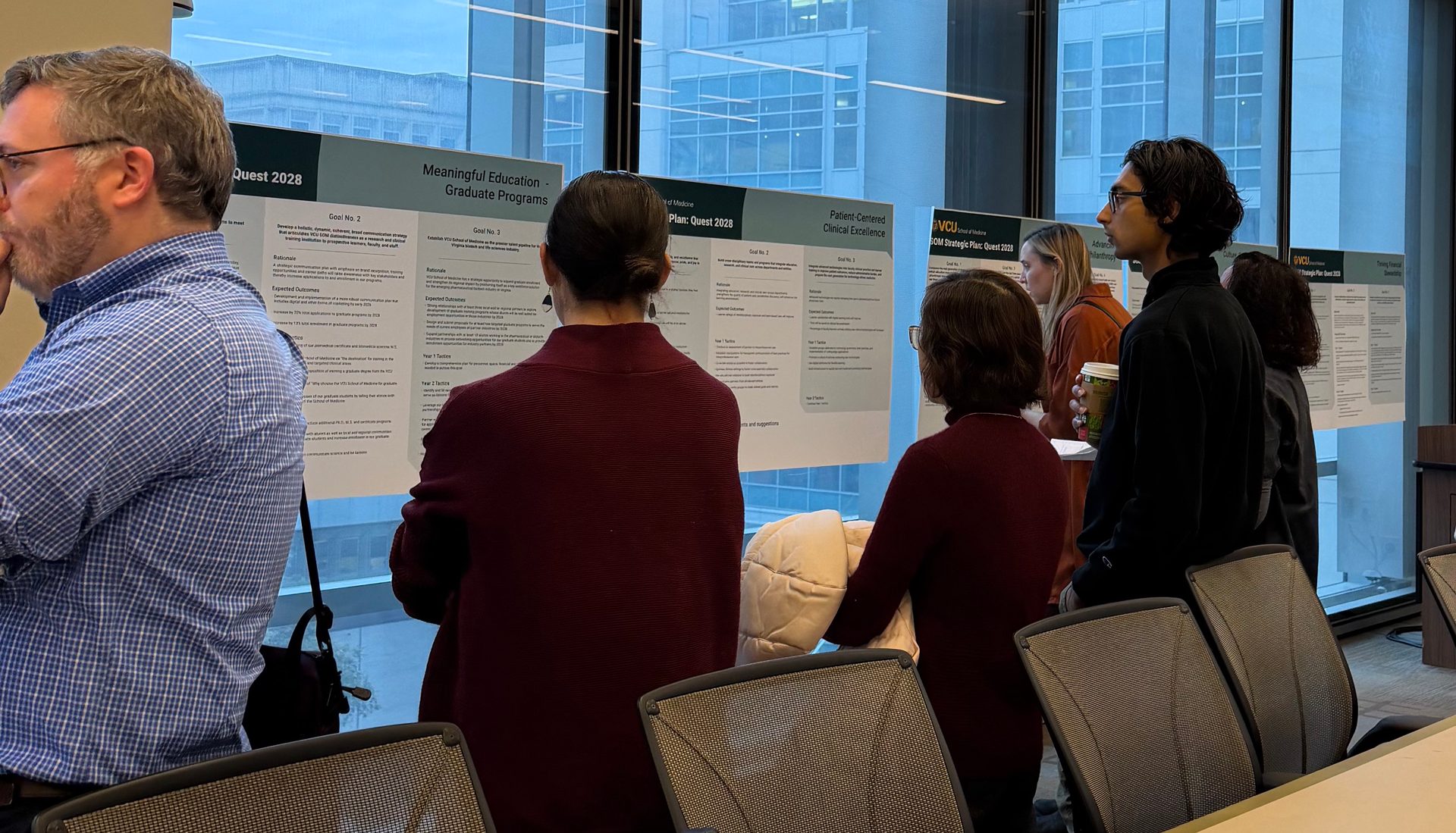 A group at MMEC discusses the strategic plan