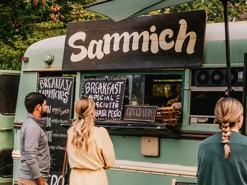Photo from Kyle Nieber of Unsplash of people at a food truck